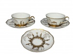 PORCELANA POLOVI, duas (2) xícaras para chá com seus respectivos pires, confeccionadas em porcelana nacional na tonalidade branca com decoração oriental com figuras e elementos vegetalistas em vasta douração, medindo 5x11,5x9,5cm