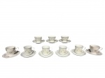 PORCELANAS, nove (9) xícaras de 3 modelos para café com seus respectivos pires confeccionadas em porcelana na tonalidade branca, sendo: A) SCHMIDT, 3 decoradas por guirlanda floral e vegetalista cinza, medindo 5x9x7cm, B) REAL, 4 decoradas por flores e folhagens em policromia e filete em ouro, 1 c/ bicados na borda, medindo 5,5x7,5x5,5cm e C) MAUÁ, 2 decoradas por elementos florais e filetes em vasta douração, medindo 5,5x8x6cm.