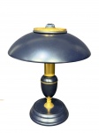 ABAJUR, um (1) abajur para uma lâmpada confeccionada em metal com esmaltagem na tonalidade azul escuro, cúpula cogumelo com arremates em metal dourado, funcionando e com fiação nova, medindo 34cm de altura.
