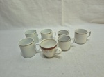Lote de 7 xícaras de café diversas em porcelana, sem pires.