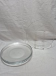 Jogo de 6 pratos rasos de mesa em vidro transparente. Medindo 24cm de diâmetro.