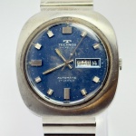 TECHNOS - Relógio automático, funcionando. Pulseira: 20mm. Caixa: 4cm x 4cm, vertical x horizontal, sem contar a coroa. ***ATENÇÃO! ESTE RELÓGIO NÃO POSSUI GARANTIA DE FUNCIONAMENTO. Produto sendo vendido conforme ESTADO, testado, ou não, diz respeito apenas ao momento da catalogação. Recomenda-se revisão.*** Se necessário, solicitar mais fotos, vídeos ou perguntas para análise via e-mail reidaantiguidade@gmail.com, Obrigado pela visita!