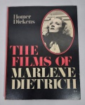 Conservado Livro  -  The films of Marlene Dietrich  -  Homer Dickens  -  Citadel  -  223 Páginas ricas em ilustrações  -  Ano 1980  - OBS: Possui Assinatura. Livro de acervo do violinista, cantor e compositor Jararaca (José Luiz Calazans) e de seu filho Luiz Calazans.   -  Medida:  28 x  21,5 x 1,5 cm.