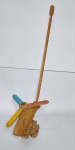 Antigo brinquedo de empurrar representando  -  Helicóptero  -  Ao empurrar as Hélices giram  -  Material: Madeira   -  Medida:  65 cm de comprimento x 9 cm de largura.