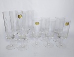 Cristais Hering - Conservado conjunto de 11 peças em Cristal com detalhes Lapidados. Sendo: 6 Taças de Champanhe e  5 Taças de Vinho. Medida Taças de vinho: 14,5 cm de altura x 5,5 cm de diâmetro. Medida taças de champanhe: 18 cm de altura x 4,5 cm de diâmetro. Cristal 24%Pbo. Conforme fotos.