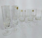 Cristais Hering - Conservado conjunto de 12 peças em Cristal com detalhes Lapidados. Sendo: 6 Taças de Champanhe e  6 Taças de Vinho. Medida Taças de vinho: 14,5 cm de altura x 5,5 cm de diâmetro. Medida taças de champanhe: 18 cm de altura x 4,5 cm de diâmetro. Cristal 24%Pbo. Conforme fotos.