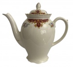 INGLATERRA - Bule em porcelana inglesa Woods Ivory Ware, corpo bojudo com bico alongado e alça lateral, decorado com frisos florais policromados e detalhes em dourado. Tampa original com pega em forma de botão. Marca do fabricante no fundo. Mede 22 cm.