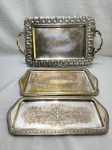 Lote de 3 bandejas retangulares diversas em prata 90. Medindo a maior 37cm x 26cm x 43,5cm alça alça. Banho com desgaste.
