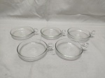 Jogo de 5 petisqueiras redondas em demicristal incolor. Medindo 9cm de diâmetro.