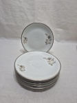 Jogo de 6 pratos de sobremesa em porcelana Renner floral com friso prata. Medindo 17,5cm de diâmetro.