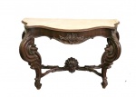 Excepcional e antigo console construido em jacarandá , tampo em mármore de carrara , elaborado em estilo neorrocó , caixa movimentada com ricos entalhes , pernas projetadas recurvas e pés amarrados por travessão e concha ao centro , Brasil séc XIX. (mármore apresenta defeito na lateral). Med. 128 x 40 x 95 cm alt