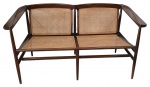 Móvel design no estilo contemporâneo - JOAQUIM TENREIRO - Lindo sofá com dois lugares, construído em jacarandá maciço, com assentos e encostos em palhinha natural. Medidas: Alt.  67 x L.125 x P.61 cm.