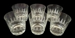 Seis copos para wisky em cristal translucido, com decoração lapidada em padrão geométrico vertical. Medindo: 9 x 9 cm.