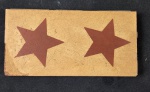 Azulejo esmaltado com estrela. Medindo: 15,5 x 8 cm. 