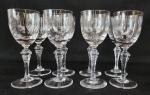 Oito taças para vinho do porto em cristal translucido com lapidação de estrelinhas. Marca ao fundo. Medindo: 12 x 4,5 cm,