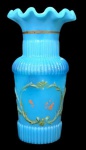 Vaso em opalina francesa em tom azul, decorado em relevo com pouco esmalte pintado a mão, com boca embabadada; Medindo 12,5 X 7 cm