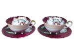 PORCELANA JAPONESA, par (2) de xícaras para chá de coleção com seus respectivos pires, confeccionadas em porcelana na tonalidade branca, parte interna esmaltada na tonalidade vinho e pintura de flor em policromia com folhagens e realces em ouro, parte externa com espessa faixa na tonalidade bege e filetes dourados, leves falhas na douração, medindo 5,5x11,5x9,5cm.