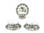 PORCELANA ORIENTAL, três (3) xícaras para chá com seus respectivos pires, confeccionados em porcelana na tonalidade branca, decorada por flores, folhagens e frutos em rica policromia com filetes e realces em ouro, medindo 5,5x11,5x9,5cm.