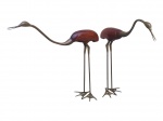 ESCULTURAS, duas (2) grandes esculturas, representando garças ou cegonhas, com corpos em madeira e pernas, pescoços, bicos e pés em bronze, uma delas necessita solda na perna, vide foto, medindo 102x13x81cm e 104x11x102cm.