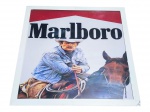 QUADRO, um (1) quadro / pôster publicitário da marca Marlboro, com representação de cavaleiro montado a cavalo e logotipo em destaque, moldura em metal com pintura branca, apresenta mossas, vide foto, medindo 62x62cm.