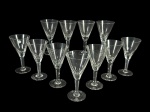 CRISTAIS, treze (13) taças para água, confeccionadas em cristal translúcido, bojo cônico com lapidação dita DEDÃO, haste facetada, apoada sobre base circular, 10 apresentam pequenos bicados na borda, medindo 18x9cm.