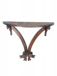 MOBILIARIO, um (1) console de parede confeccionado em madeira escura, tampo meia lua, laterais recortadas, hastes curvas finalizada em laçarote, medindo 66x67,5x20cm.