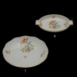 HEREND  Conjunto composto por 7 covilhetes e 8 cinzeiros em porcelana húngara, ornamentada em policromia floral e filetes a ouro. Marcas da manufatura sob as bases 12 cm (covilhetes). 9 x 6 cm (cinzeiros).