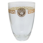 ROSENTHAL Design da MAISON VERSACE. Modelo Medusa Lumiere -  Vaso floreiro em cristal translucido. Barra com gregas e medalhão dourado ao centro. Peça assinada. 25 x 18 cm.