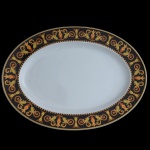 PAUL WUNDERLICH (German 1927-2010) For VERSACE. Modelo Barroco. Manufatura by Rosenthal - Travessa de formato oval em porcelana alemã  Marca da manufatura no verso da peça. 30 x 40 cm