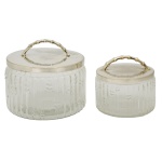 St. JAMES  Par de potes circulares em cristal translucido. Tampa em metal prateado da manufatura nacional St James. Apresenta desgastes nas tampas. 15 x 17 cm e 12 x 12 cm.