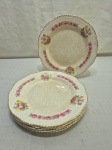 Jogo de 6 pratos rasos de mesa em faiança Inglesa, floral com friso ouro. Medindo 23cm de diâmetro. Peças com manchas.