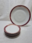 Jogo de servir bolo com 5 pratinhos em porcelana Renner Donaire vinho com friso ouro. Medindo o de servir 29cm de diâmetro, sobremesa 17,5cm de diâmetro. Desgaste no friso.