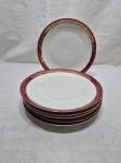Jogo de 6 pratos rasos de mesa em porcelana Renner Donaire vinho com friso ouro. Renner Donaire friso com desgaste Medindo 23cm de diâmetro. Desgaste no friso.