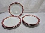 Jogo de 6 pratos em porcelana Renner Donaire vinho com friso ouro. Sendo 3 de cada. Medindo mesa 23cm de diâmetro, sopa 22cm de diâmetro. Desgaste no friso.