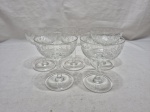Jogo de 5 taças abertas em demicristal lapidado. Medindo 9cm x 11,5cm de altura.