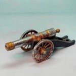 COLECIONISMO - Miniatura de canhão de guerra, italiano. Med. 5x14x4,5 cm. Cromado, porém com desgastes.