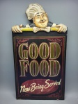 QUADRO - Quadro decorativo Good Food. Cozinheiro. MDF - Marcas do tempo e de uso. Med. 56x30 cm. No estado.