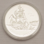 Numismática, Canadá. Dolar. 1999. Prata 925. Proof. Encapsulada. Certificada e no estojo. 25,175g de prata comemorativa. 225 aniversário. Viagem ás IlhasRainha Charlotte. KM356. 