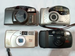 Lote contendo quatro antigas câmeras fotográficas.  Olympus Accura zoom XB70, Tron Big View BV-Metal, Canon Prima BF 800 e Kodak Star 1035Z. Para conserto ou retirada de peças.