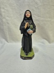 Imagem de madre Cabrini em gesso pintado. Medindo 19,5cm de altura.