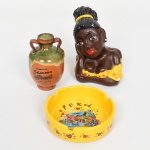 SOUVENIRES, três (3) distintos: 1 cinzeiro, origem Peru, confeccionado em louça com paisagem policromada sobre fundo amarelo, medindo 10 cm diâmetro; 1 pequeno vaso em cerâmica, origem Salamanca, medindo 9,5 cm altura, esmaltação vítrea com predominância da tonalidade verde; 1 escultura figurativa, feminina, confeccionada em estuque, policromada, origem São Tome das Letras, pequenos defeitos, medindo 12,5 cm altura, vide foto.