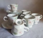 7 xícaras café com pires em porcelana branca Schmidt Classic com decoração de flores em suaves tons. Borda filetada prata. Acompanha 1 pires extra para reposição