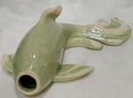 Linda escultura representando peixe, usado como floreira de parede, na cor VERDE AGUA, com mesclado BRANCO  . Medindo 29 cm de comprimento.
