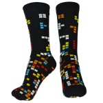 Meia preta, sem uso, com etiqueta, de cano alto, estampada com jogo tetris. Tamanho: 38 a 43.