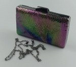 Bolsa de Festa Clutch Retangular, forrada com detalhes brilhosos no tom furta cor .Acabamento e alça no tom grafite  . Medindo :19x10x3 cm. Super Elegante e Sofisticada.