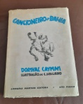 ANTIGO LIVRO DE DORIVAL CAYMMI COM ILUSTRAÇOES DE CLOVIS GRACIANO E PREFACIO DE JORGE AMADO - SEGUNDA EDICAO - NO ESTADO CONFORME FOTOS
