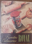 Antigo Livro de Receitas Culinárias Fermento Royal - Década de 30/40 - "Receitas Culinárias Royal", publicado pela Standard Brands of Brazil Inc. Esta edição específica, com a ilustração clássica de uma lata de fermento cercada por utensílios de cozinha (como o rolo de massa e formas de empada), é altamente colecionável por seu valor histórico e nostálgico.