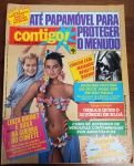 Revista Contigo! Nº 489 (Fevereiro/1985) - Luiza Brunet e Xuxa - Carnaval 85 - Este exemplar original apresenta uma das capas mais vibrantes da década, unindo as duas maiores modelos e personalidades da época: Luiza Brunet e Xuxa Meneghel, preparadas para a "Guerra do Confete" no Carnaval.