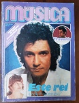 edição nº 28 da Revista Música, publicada no final de 1978. Trata-se de uma capa polêmica e instigante sobre o "Rei" Roberto Carlos, com a manchete: "Este rei ainda é soberano?". É um item de colecionismo "pop" por excelência, pois captura o momento em que a Jovem Guarda e o Romantismo enfrentavam a explosão da era Disco e do cinema.
