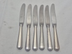 Jogo de 6 facas de sobremesa em prata 90 Wolff, modelo grego. Medindo 21cm de comprimento. Necessita de limpeza.